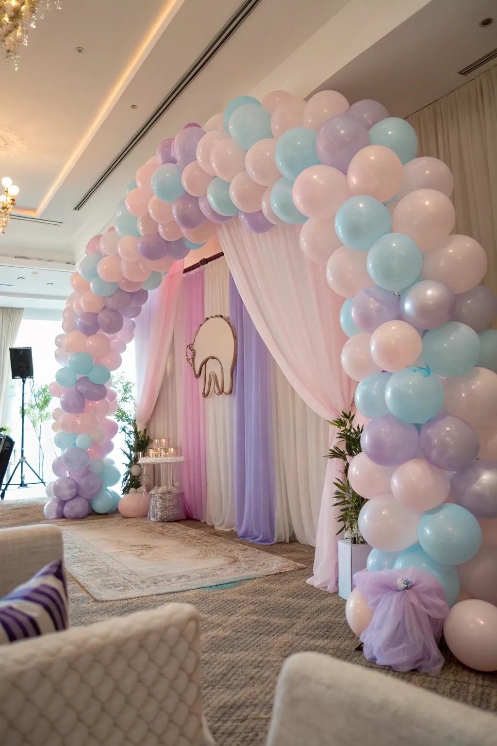 Step into a world of wonder with pastel balloon arches that set the perfect tone for an elephant-themed baby shower.